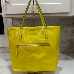 Kate Spade Tote. Zip storage outside. Inside printed lining. Neon Vinyl.